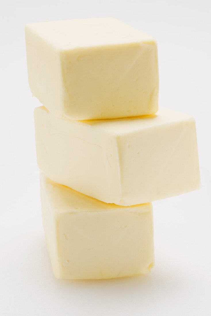 Three blocks of butter, stacked (butter mountain)