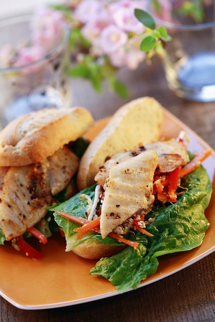 Fried fish fillet and salad sandwiches