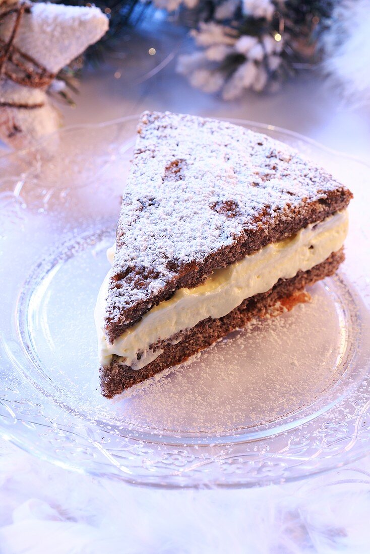 A piece of poppy seed cake with cream filling