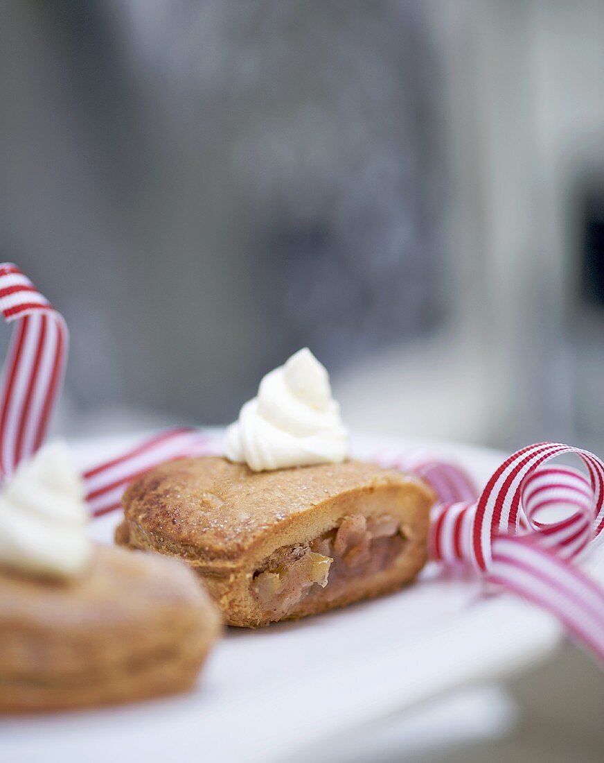 Small apple turnovers with whipped cream