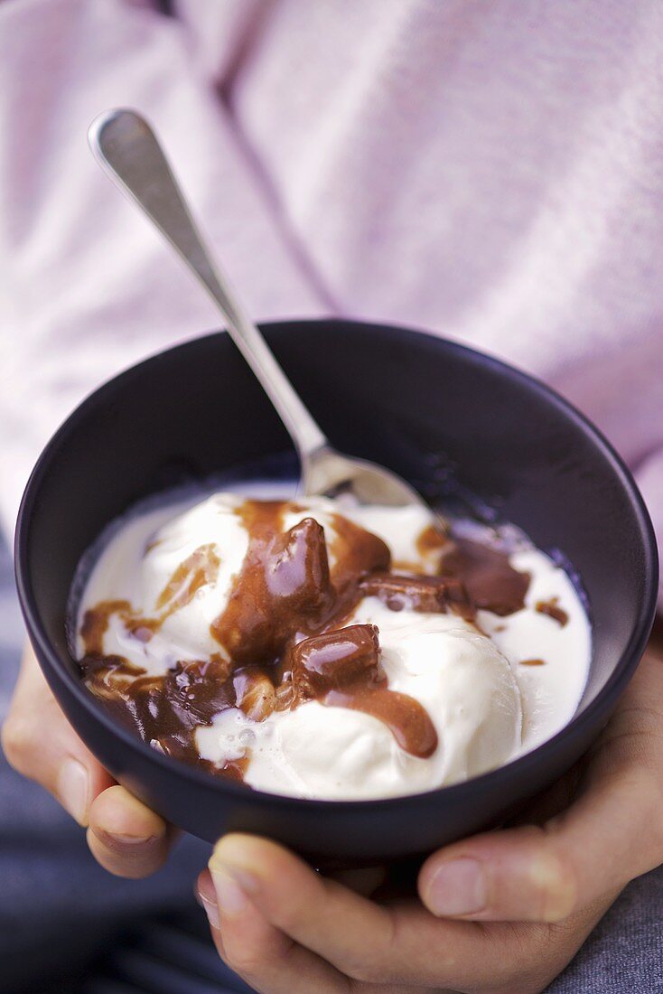 Vanilla ice cream with melted chocolate bar