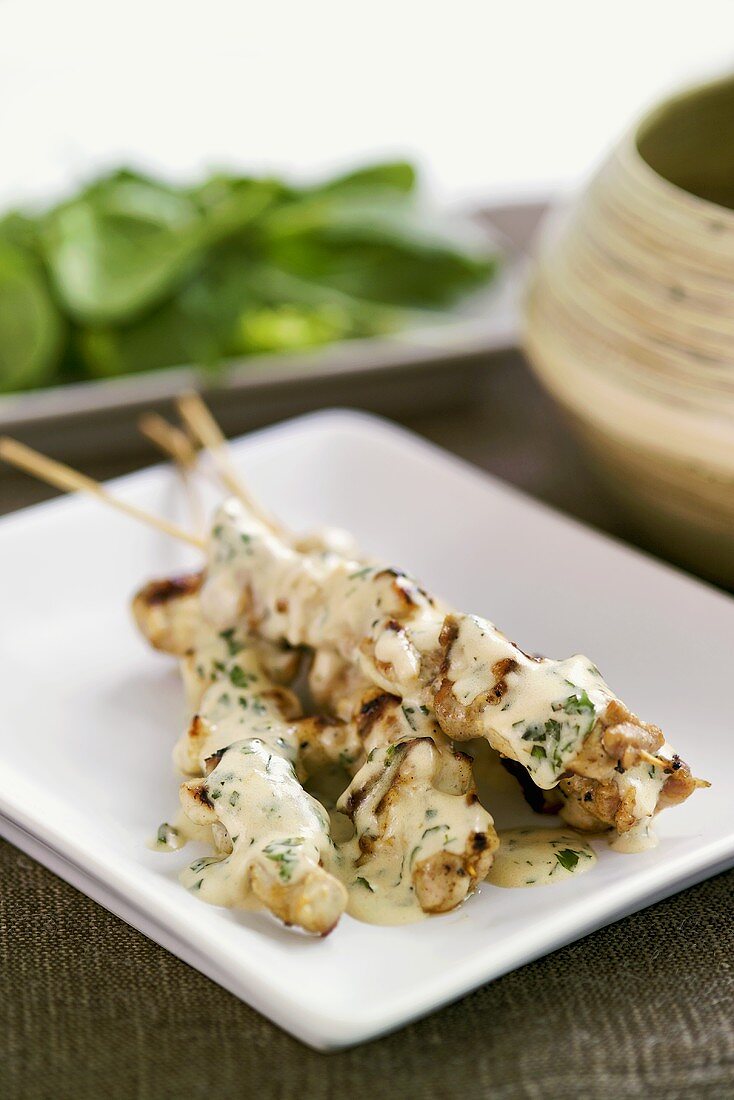 Chicken satay with ginger and coconut sauce