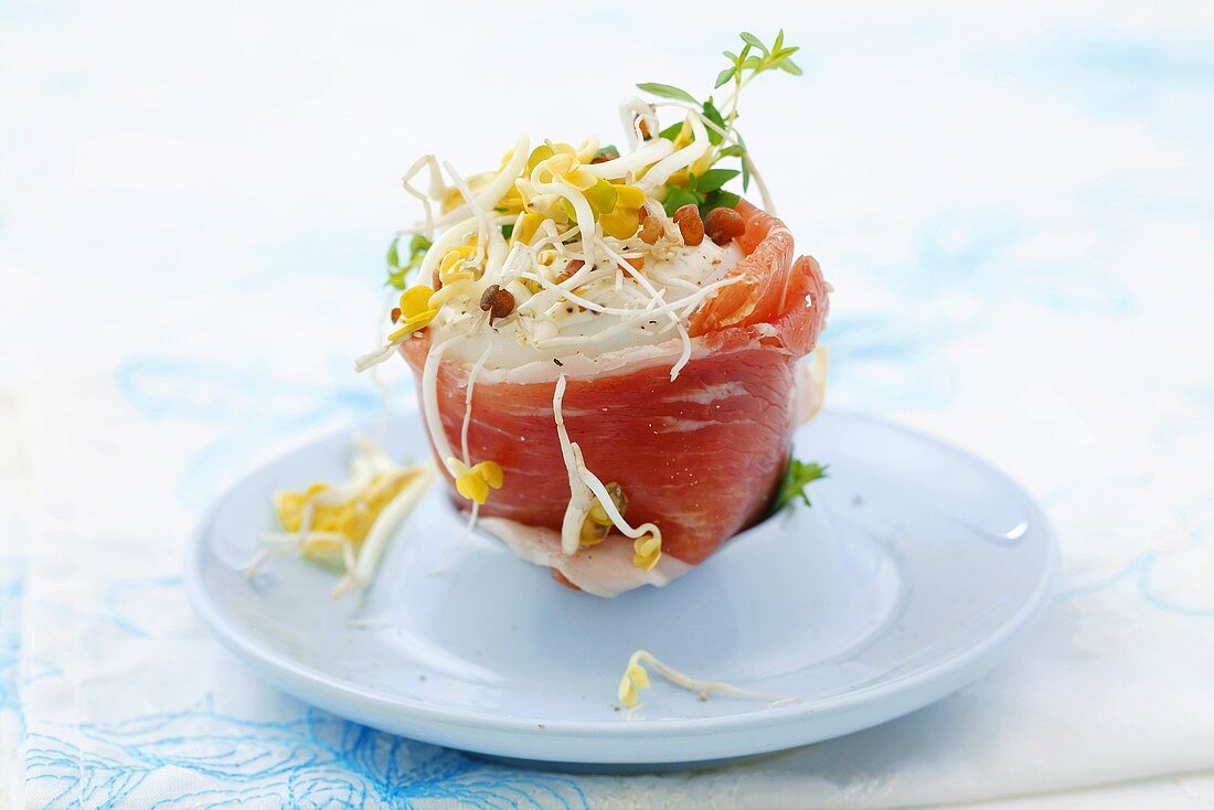 Boiled egg wrapped in Serrano ham with mayonnaise & sprouts