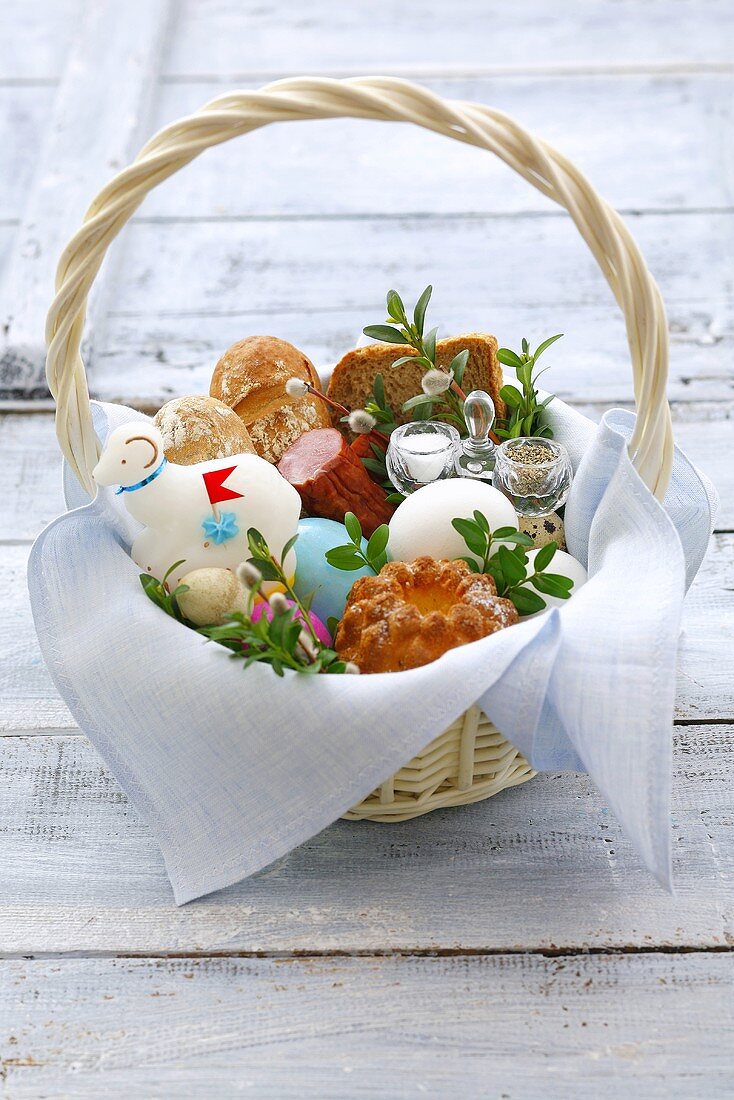 Easter eggs, sausage, baba & Easter lamb in basket (Poland)