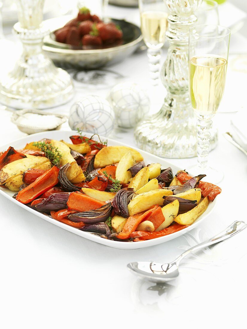Roasted vegetables on festive table (Christmas)