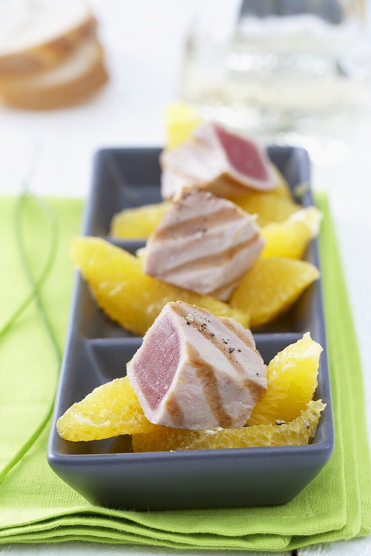 Grilled tuna with orange segments