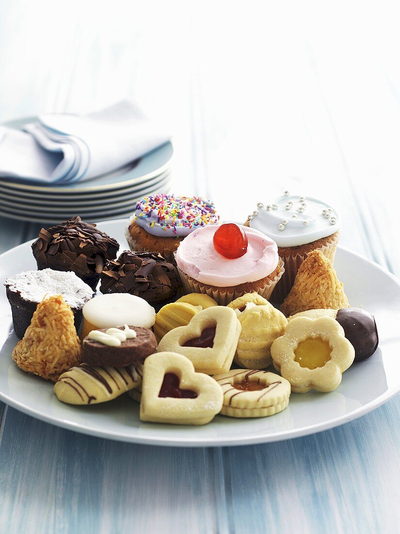 Cupcakes and biscuits on a plate