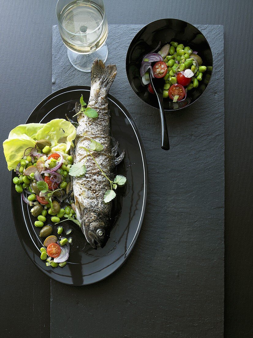 Baked trout with broad bean salad