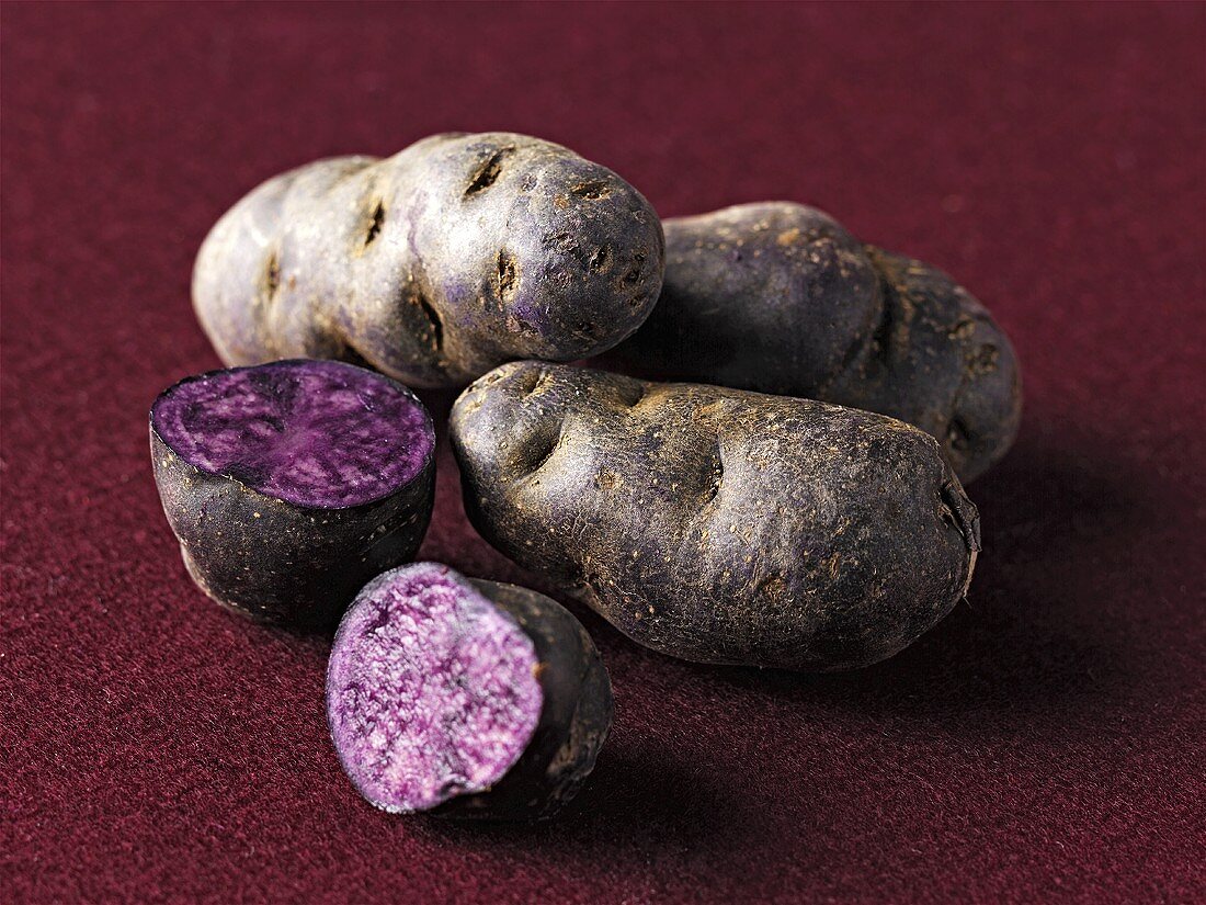 Purple potatoes, whole and halved