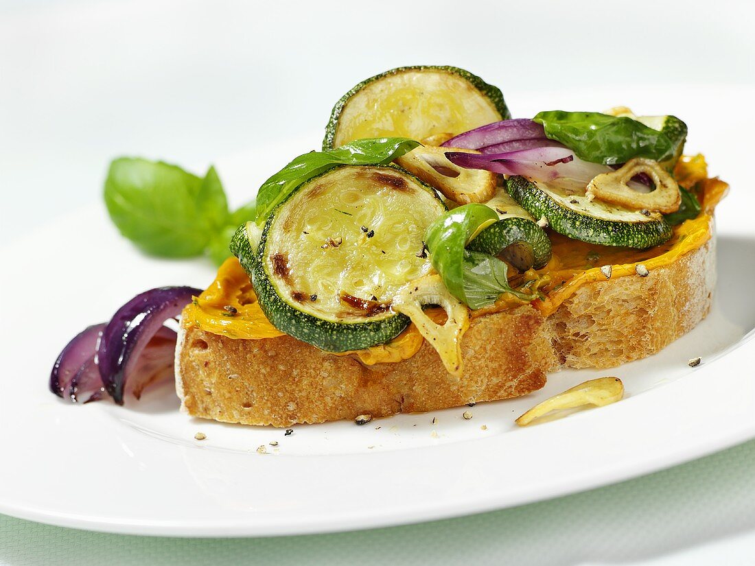Open sandwich topped with fried courgette slices