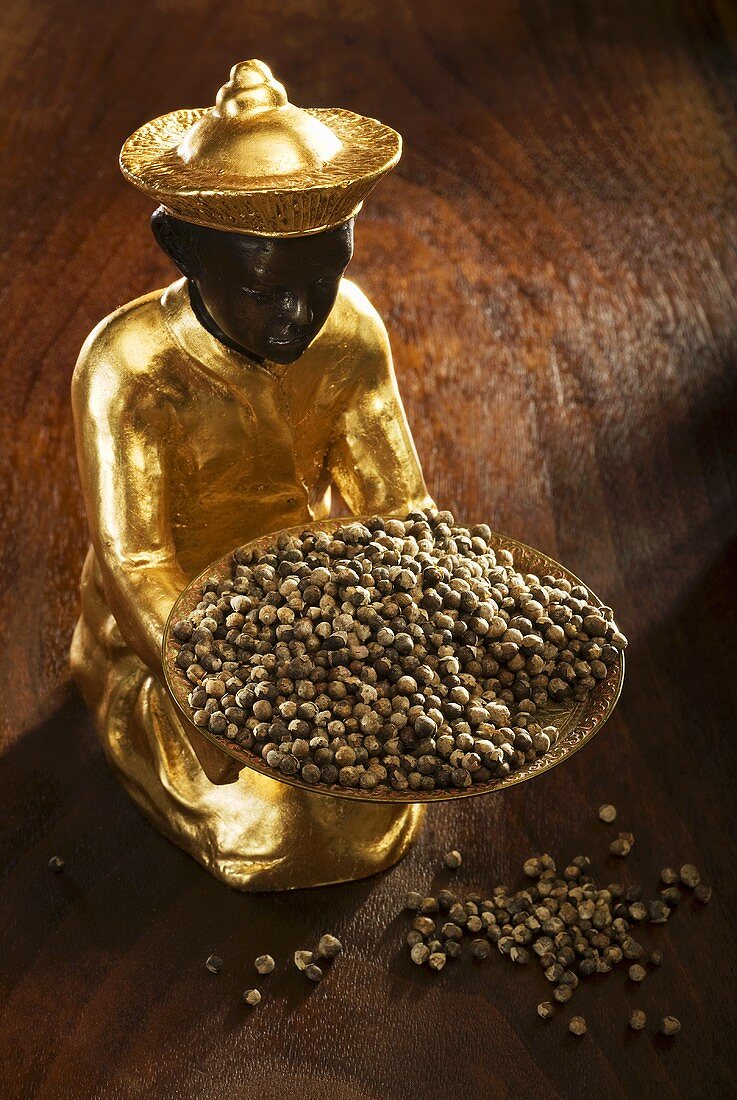 Gilded statuette with monk's pepper (Vitex agnus-castus)