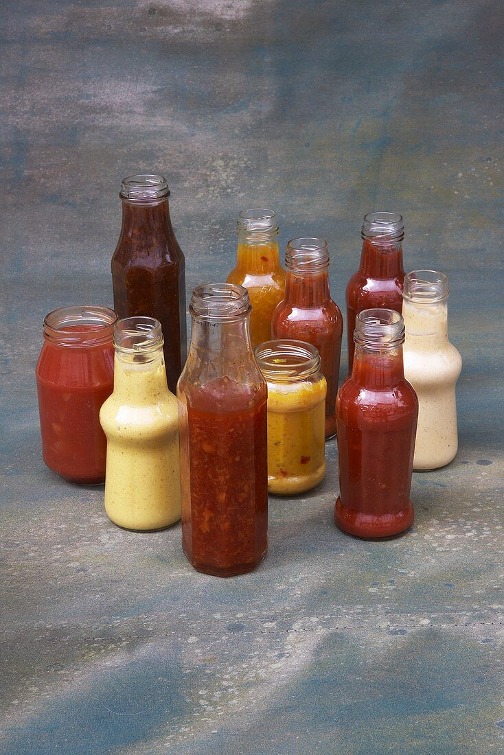 Various barbecue sauces in glass bottles