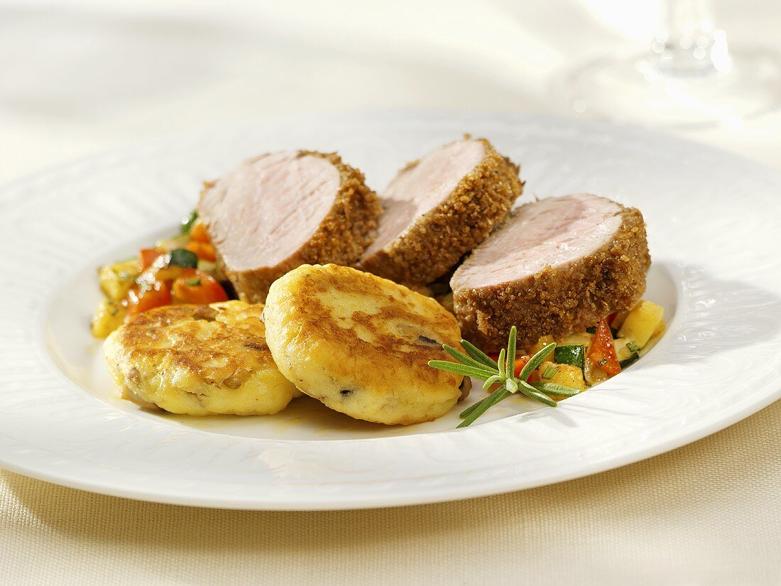 Breaded pork fillet with potato cakes