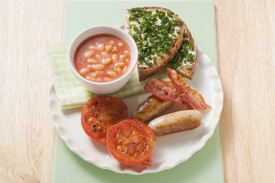 Sausage, bacon, tomatoes, beans & bread & chives for breakfast