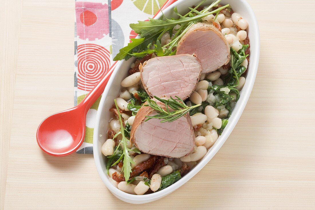 Pork fillet with beans and rocket