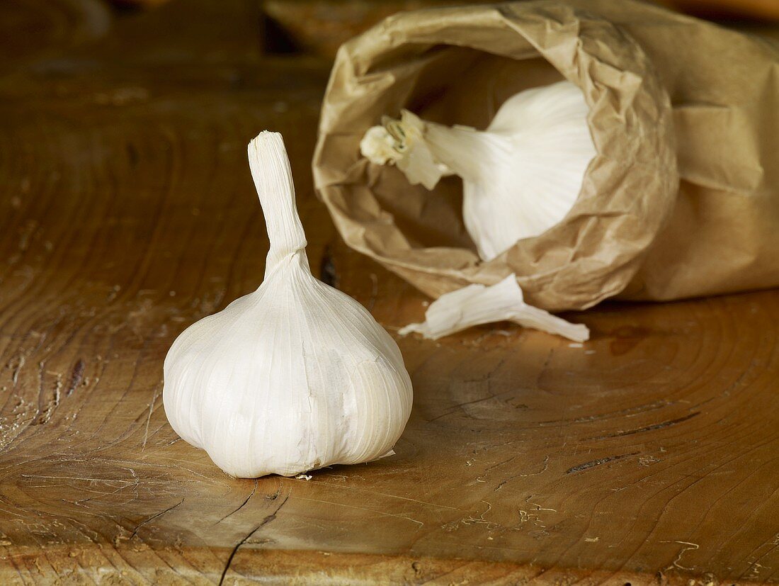 Garlic in and in front of paper bag