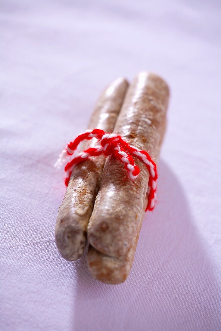 Three finger biscuits tied together