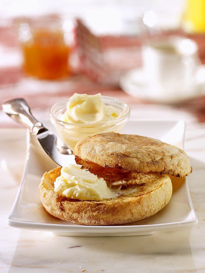 Bread roll with butter and jam