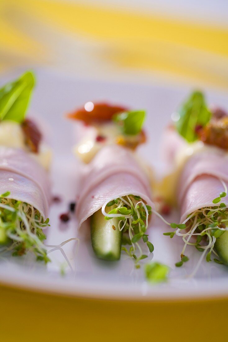 Cucumber sticks and cress wrapped in ham