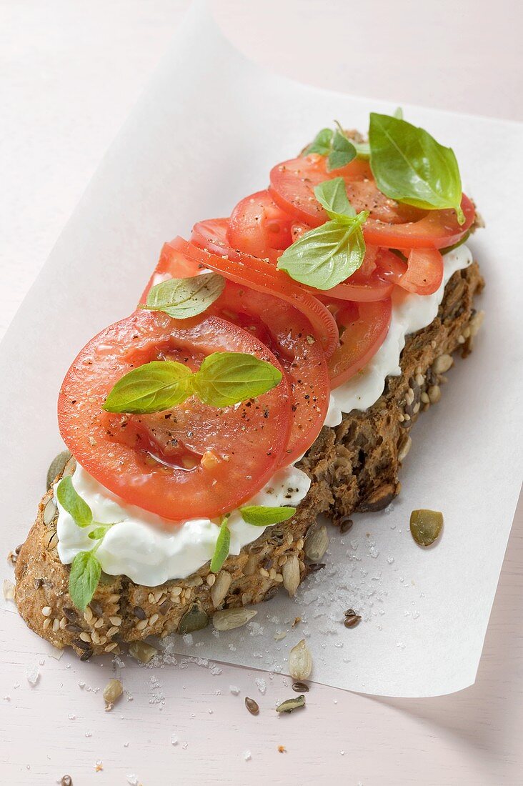 Soft cheese and tomatoes on bread