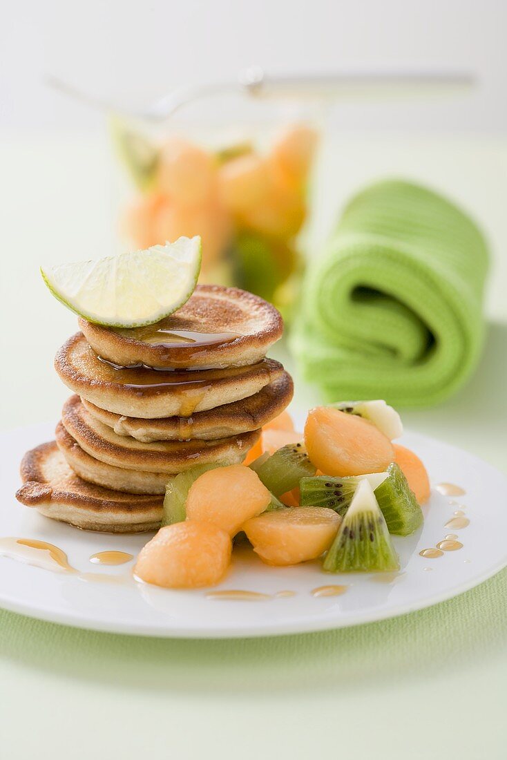 Buckwheat pancakes served with fruit salad