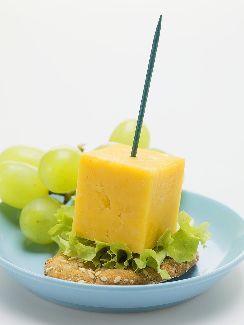 Cheese on cocktail stick with grapes