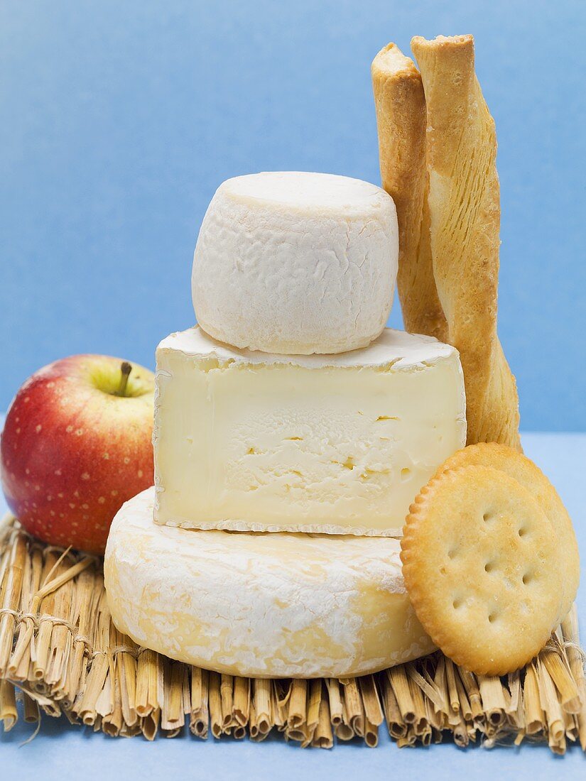 Various cheeses, cracker, savoury sticks and apple