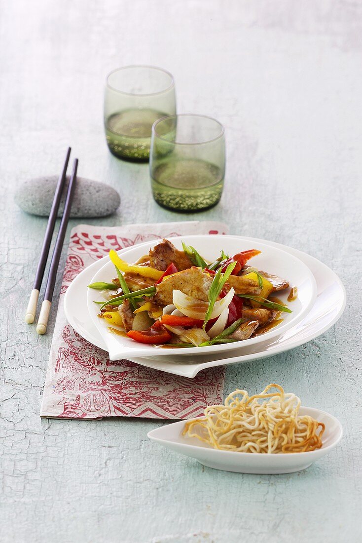 Sweet and sour pork with deep-fried noodles