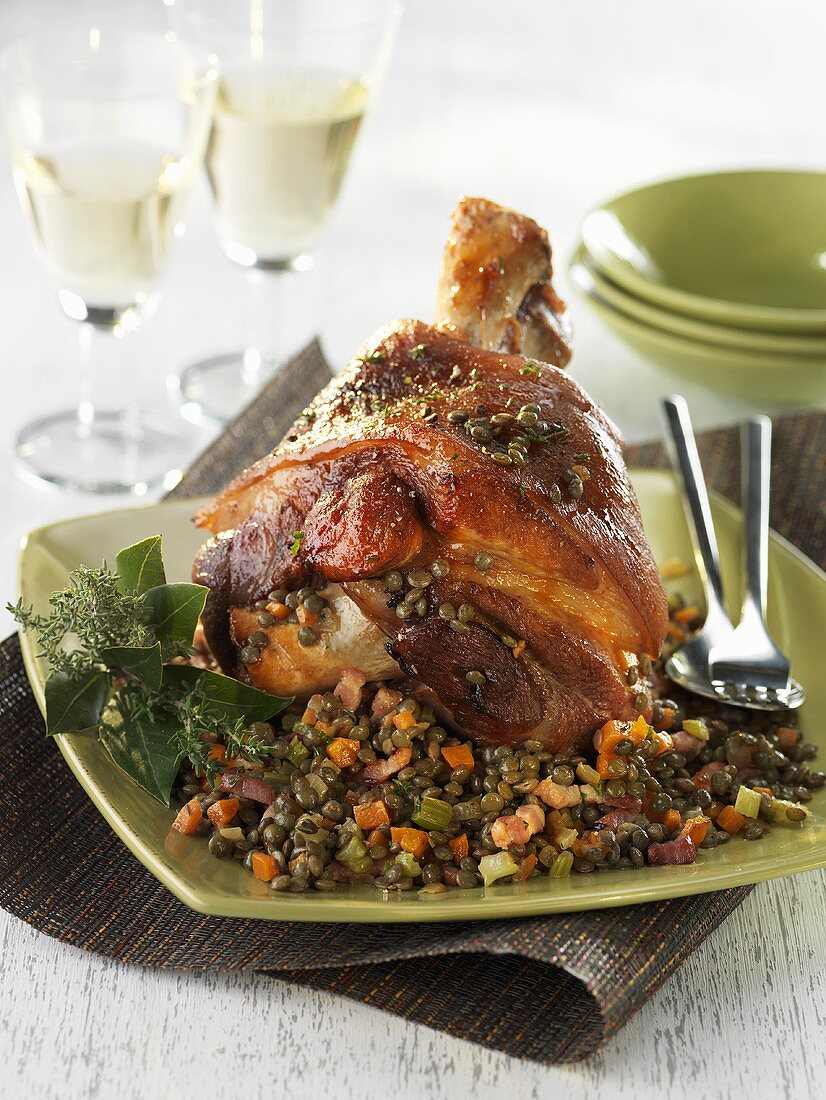 Braised knuckle of pork on lentils