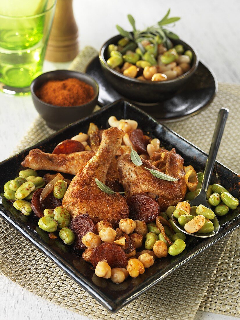 Chicken pieces with chorizo and beans