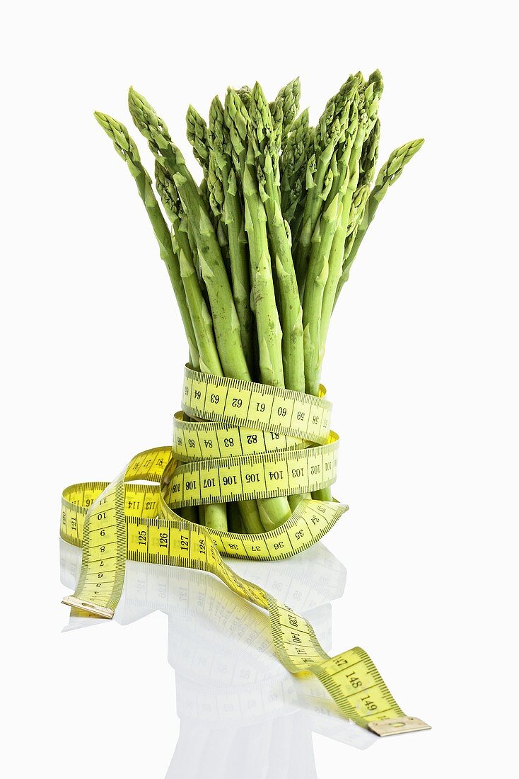 Green asparagus with tape measure