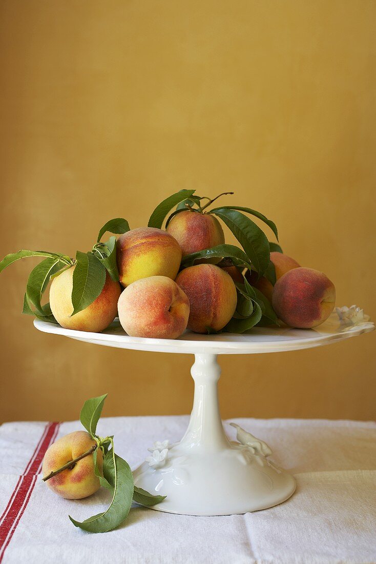 Peaches on a cake stand