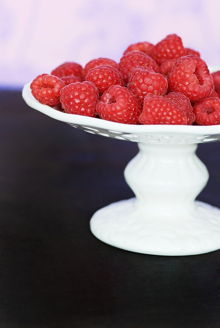 Raspberries in pedestal bowl