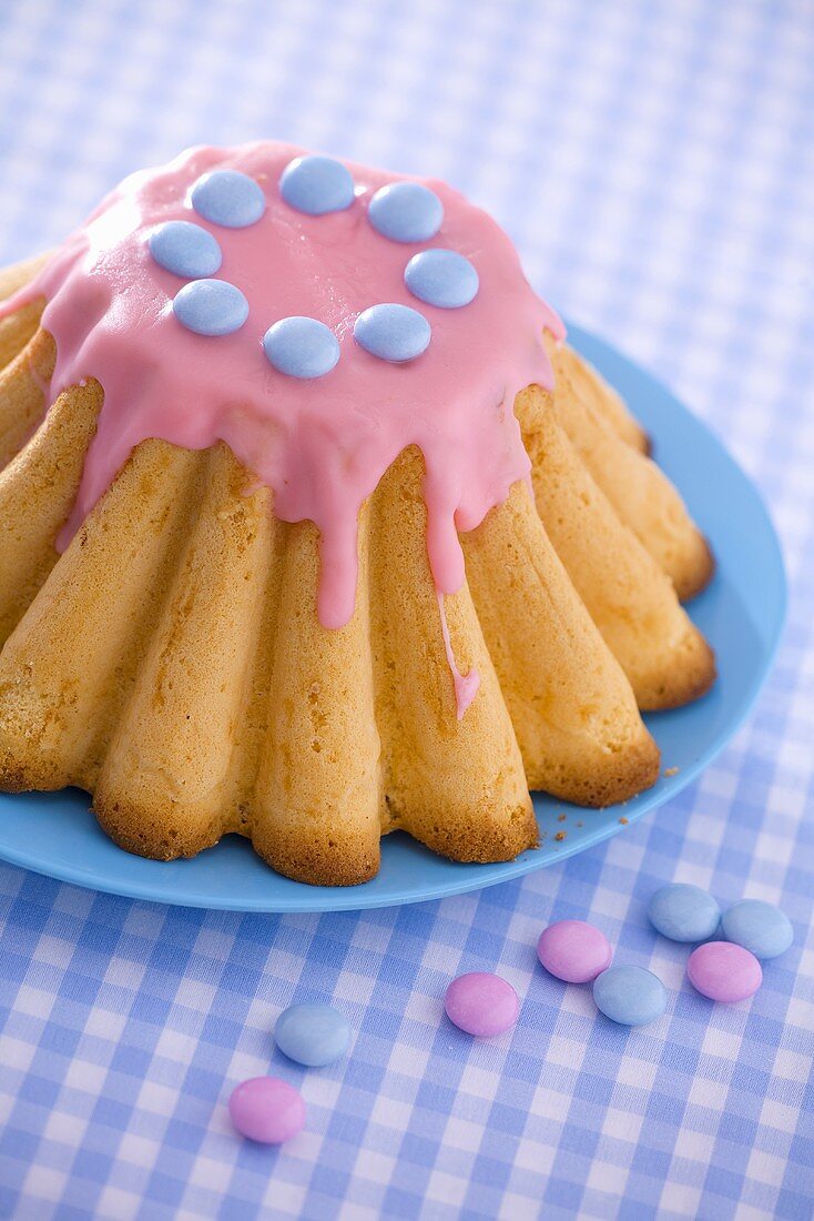 Polish Easter cake with pink icing and chocolate beans