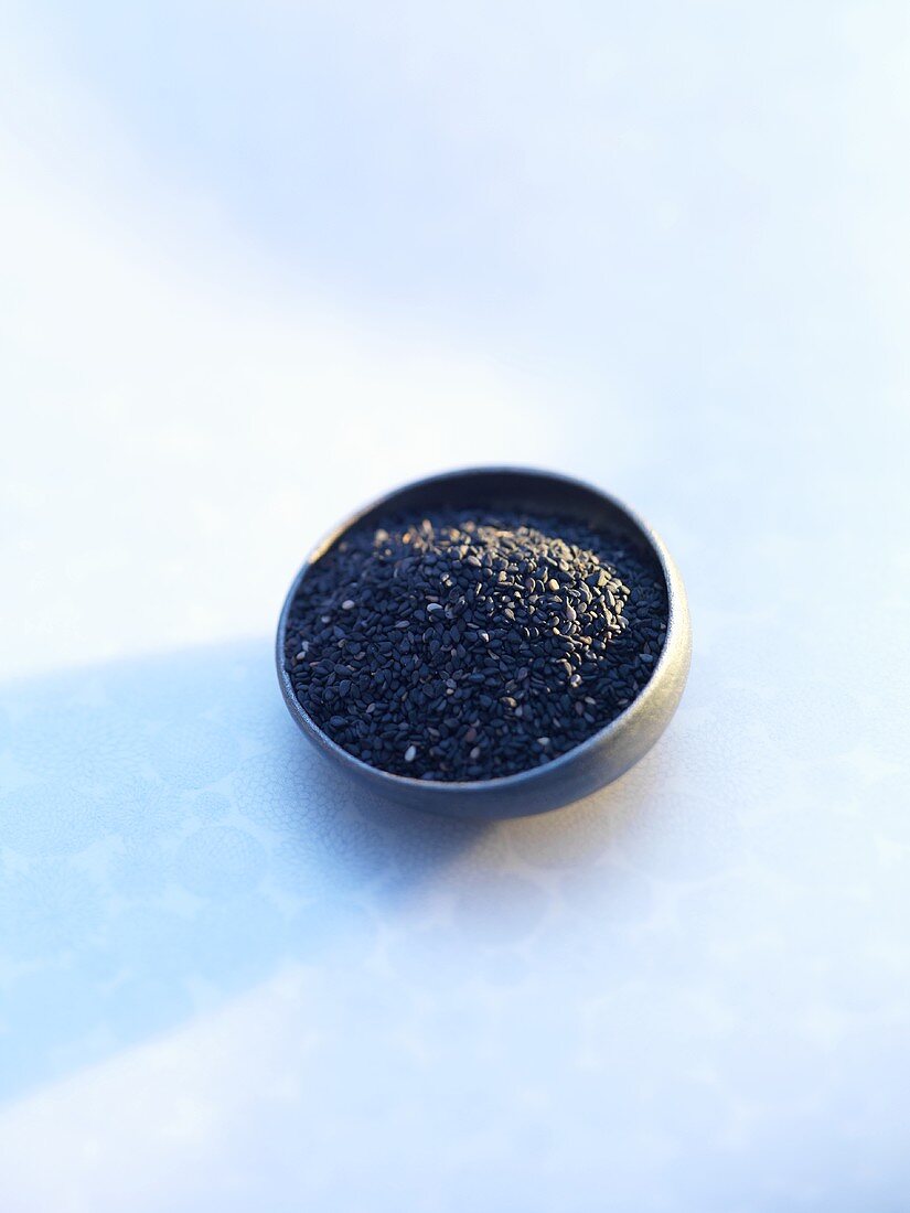 Black sesame seeds in a small dish