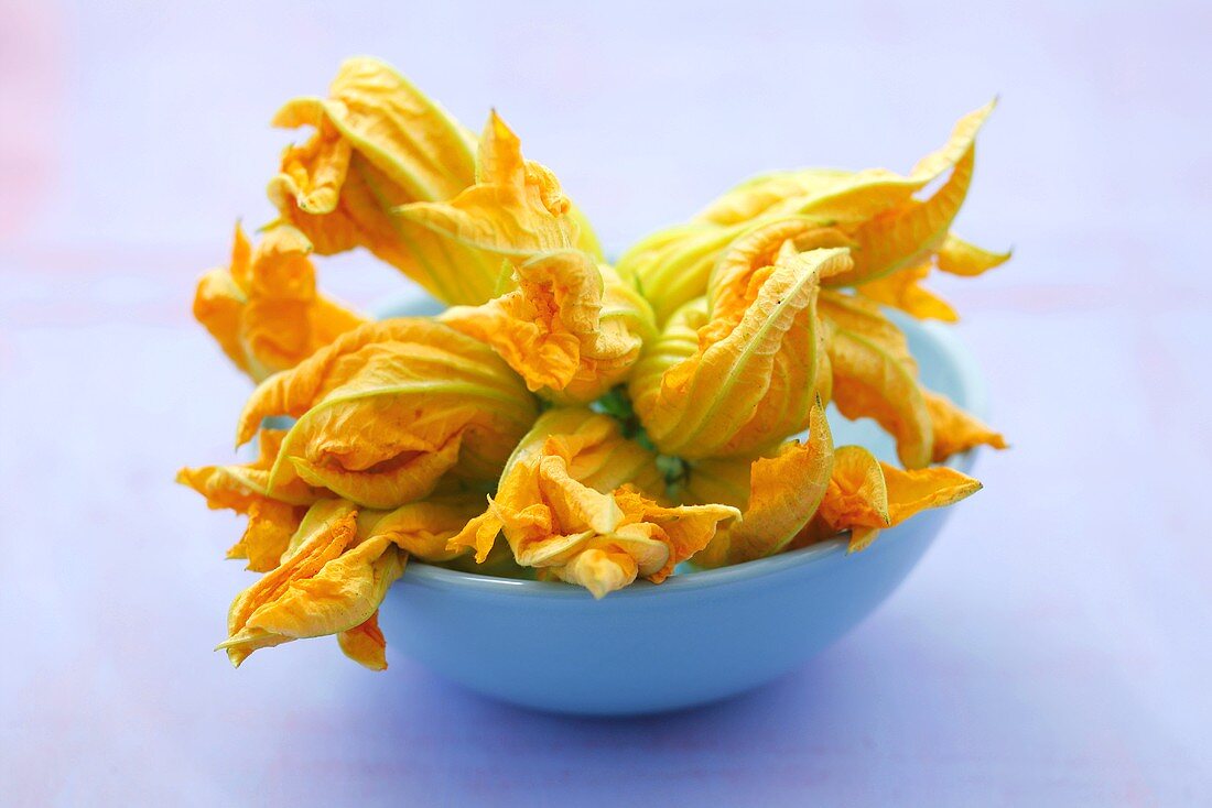 Courgette flowers in a small bowl