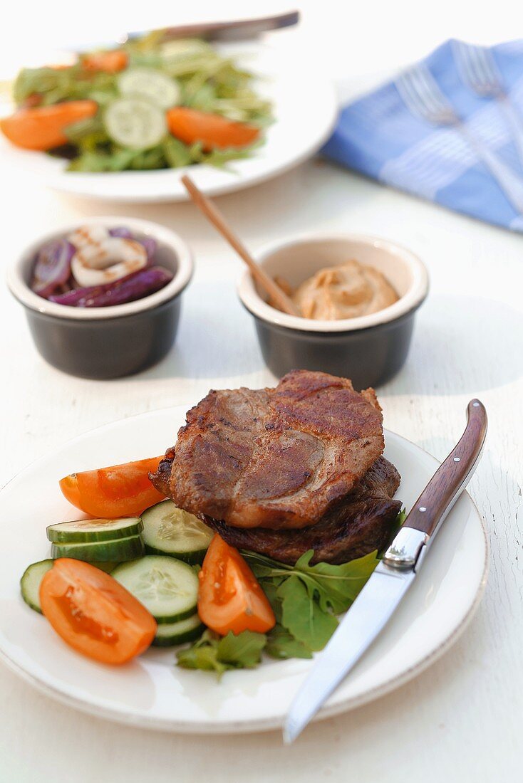 Grilled pork neck steak with vegetables