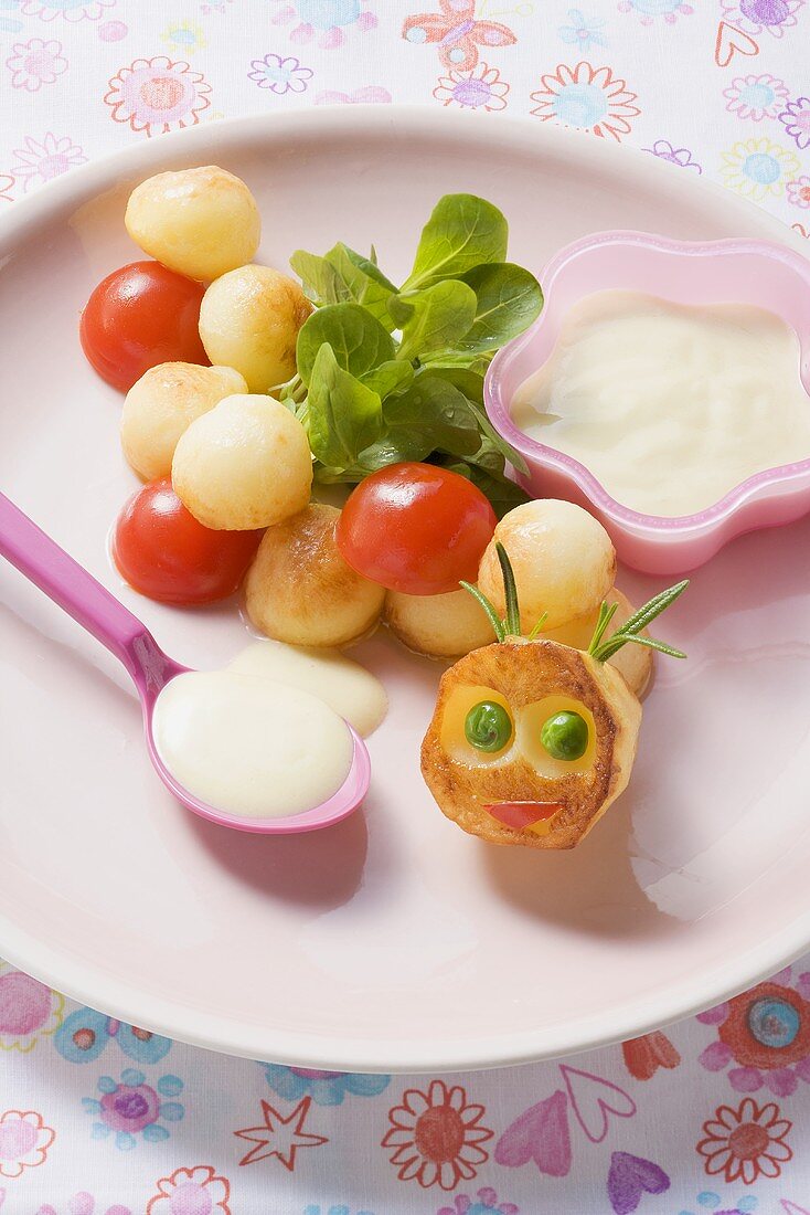 Potato and tomato caterpillar with corn salad