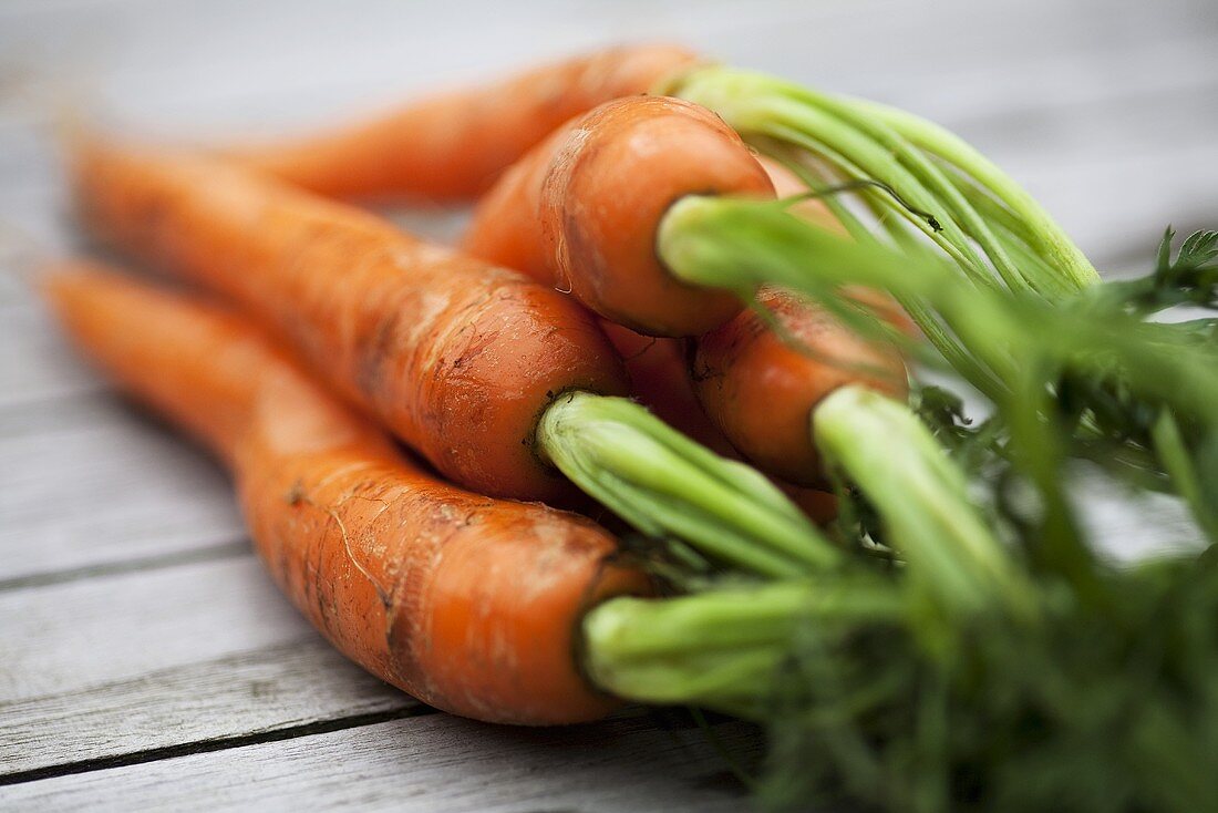 Fresh carrots on wooden table