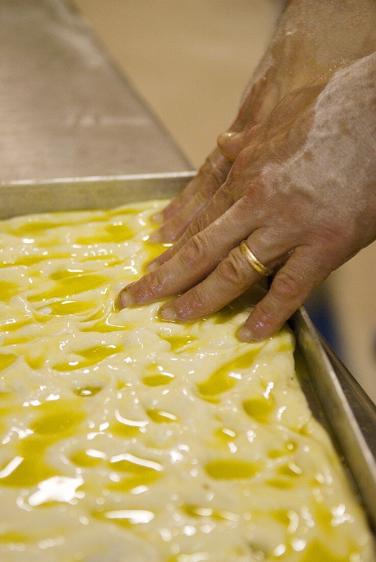 Making focaccia (spreading the dough)