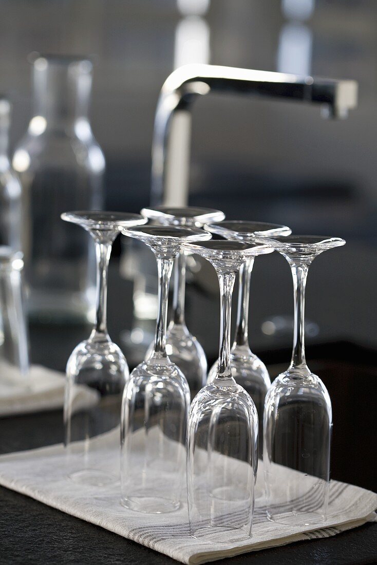 Empty sparkling wine glasses on a tea towel