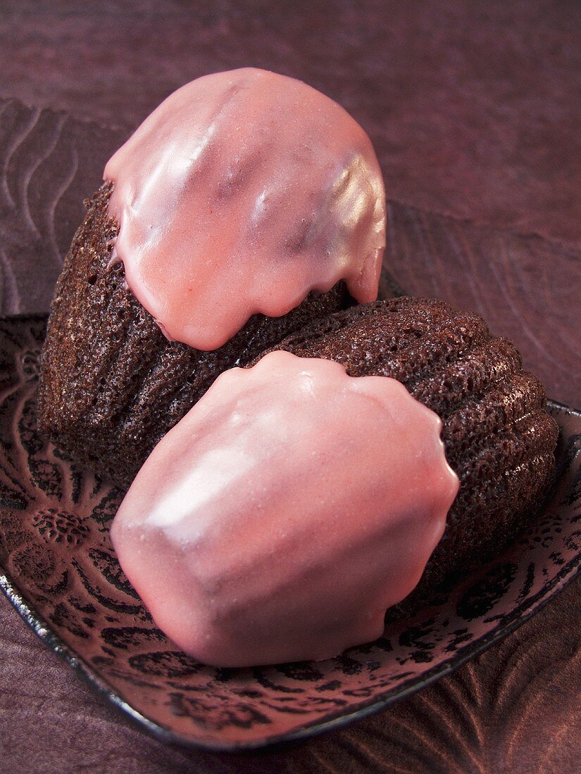 Chocolate madeleines with strawberry icing (France)