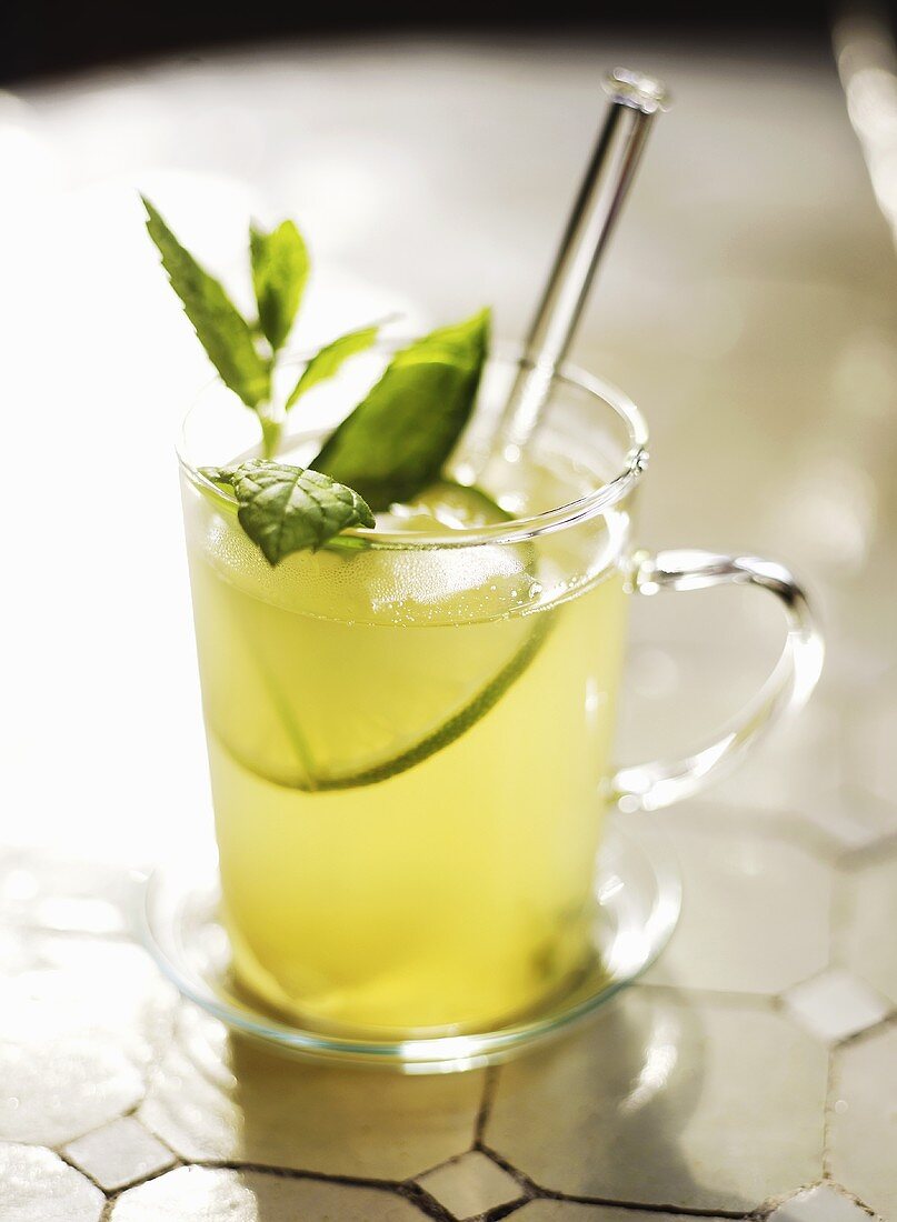 Lemon mint tea in a glass cup (Morocco)