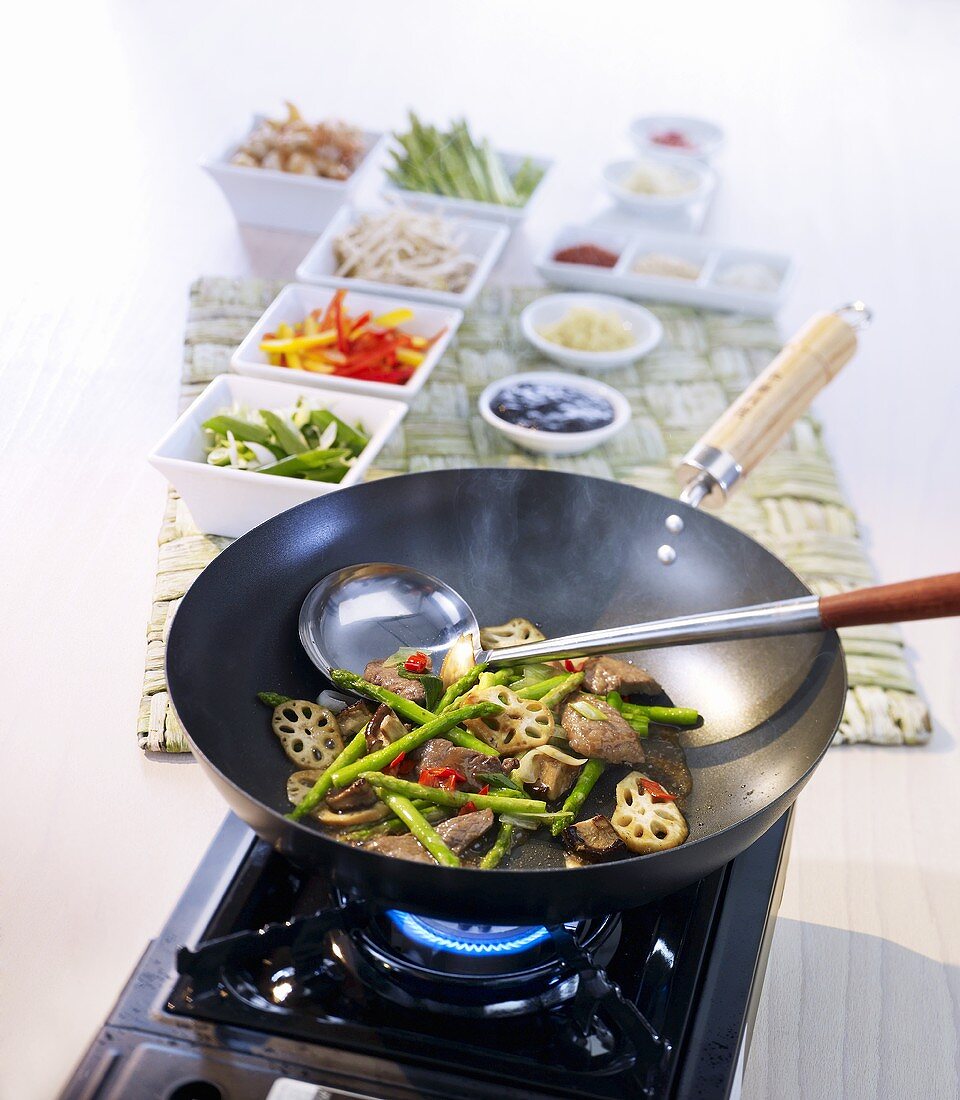 Assorted vegetables and mushrooms in wok