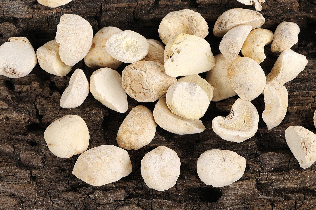 Pinellia tubers on wooden background