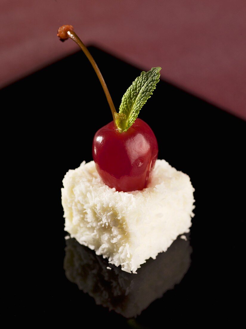 Coconut appetiser with cherry