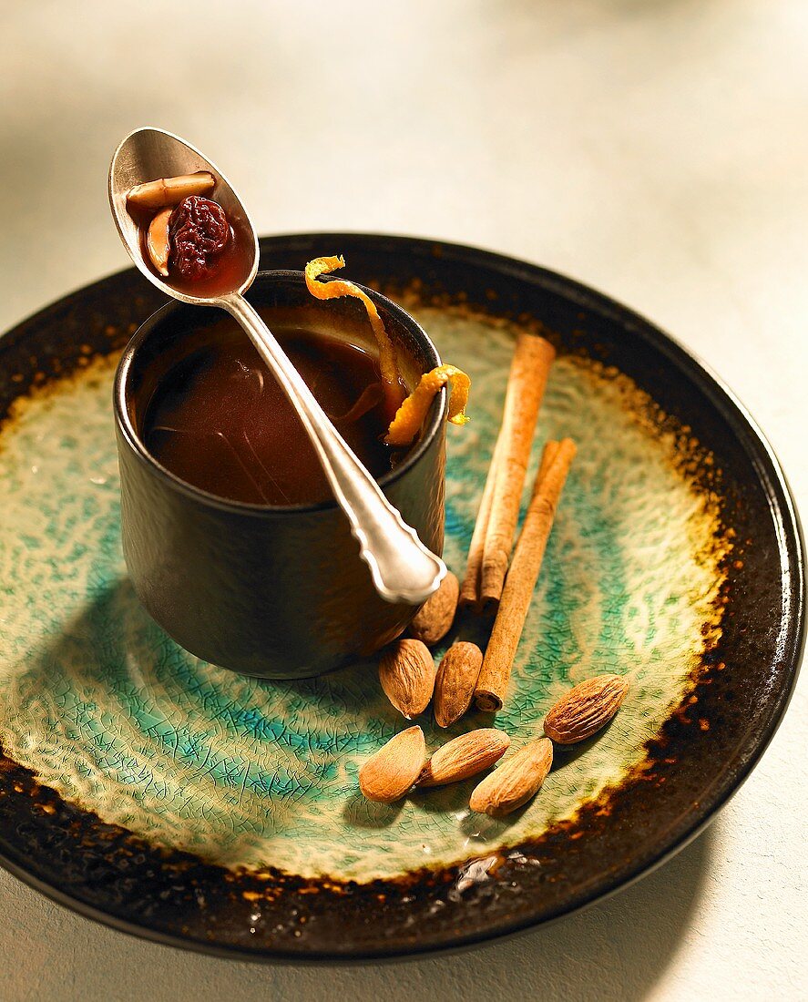 Glogg (mulled wine) with cinnamon and almonds