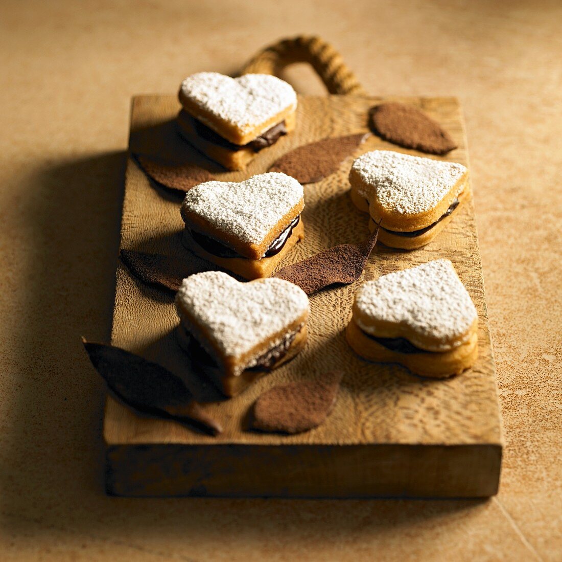 Heart-shaped filled chocolate biscuits