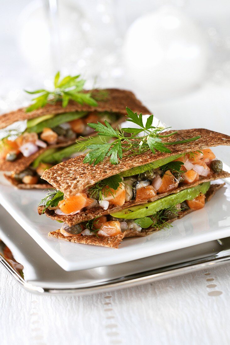 Millefeuilles of salmon & oyster tartare, avocado and bread