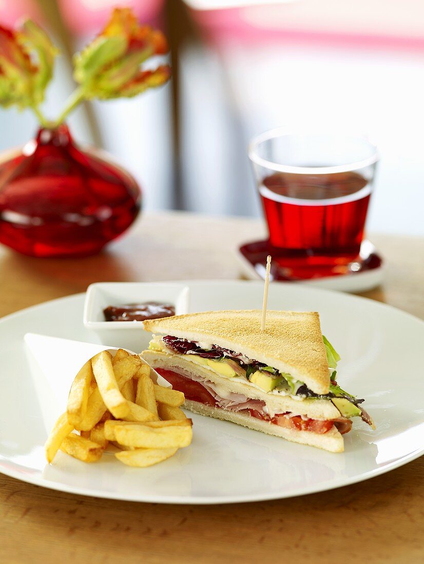 Club sandwich with chips and ketchup